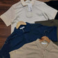 knit polo shirts in various neutral colors.(PACK OF 3)